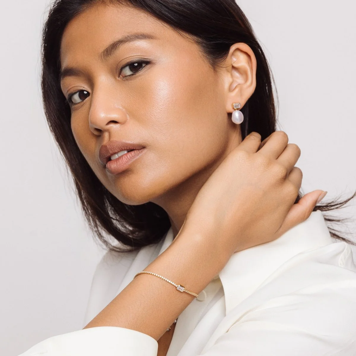 Pearl Drop Stud Gold Earrings with Baguette Cubic Zirconia - Image 4